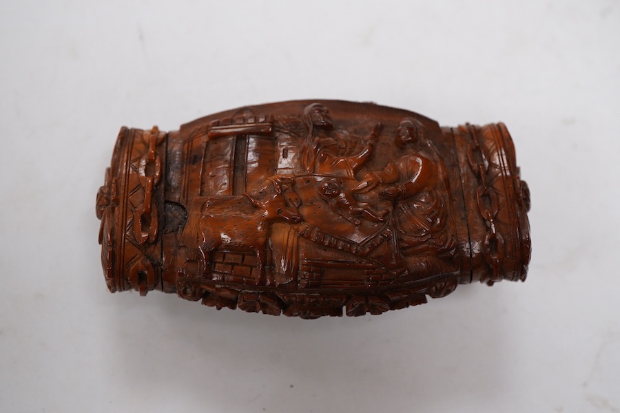 An 18th / 19th century European carved figural coquilla nut snuff box, 8.5cm wide